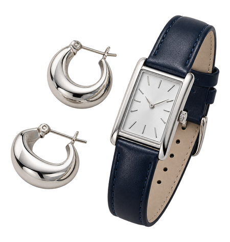 Silbercreolen und schmale Armbanduhr